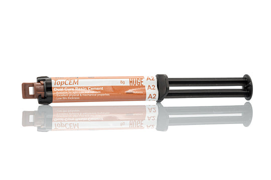 TopCEM Dual Cure Resin Cement syringe with orange label showing product details, featuring black plunger mechanism and double-barrel design for professional dental restoration applications, displayed against white background with reflection