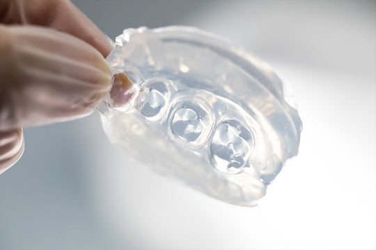 Clear dental transparent matrix mold for PERFIT Regular Body-Transparent being held against light, showcasing its extreme clarity and precision for dental restoration procedures