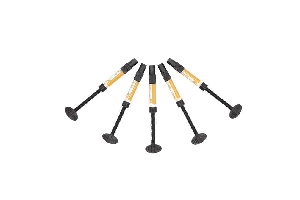 Six black and yellow TrusFIL Universal Composite Restorative syringes arranged in a fan pattern with dispensing tips, showcasing dental restoration material with nanostructured filler technology