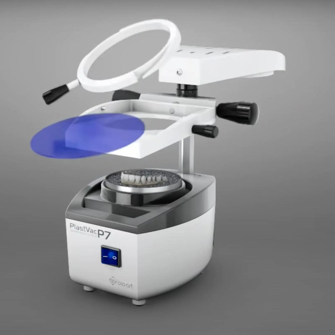 BIOART Dental Vacuum Forming Machine PLASTVAC-P7 with circular heating element, blue circular plate, and white base unit for thermoforming dental appliances and molds in laboratory settings.