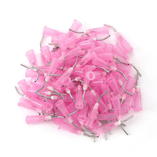 5 Bags Dental Pre Bent Needle Tips 9 Models 100pcs/Bag: Pink plastic dental needle tips with metal inserts scattered on white background, showcasing various sizes for professional dental use. Product image displays multiple single-use luer lock syringe tips for dental procedures.