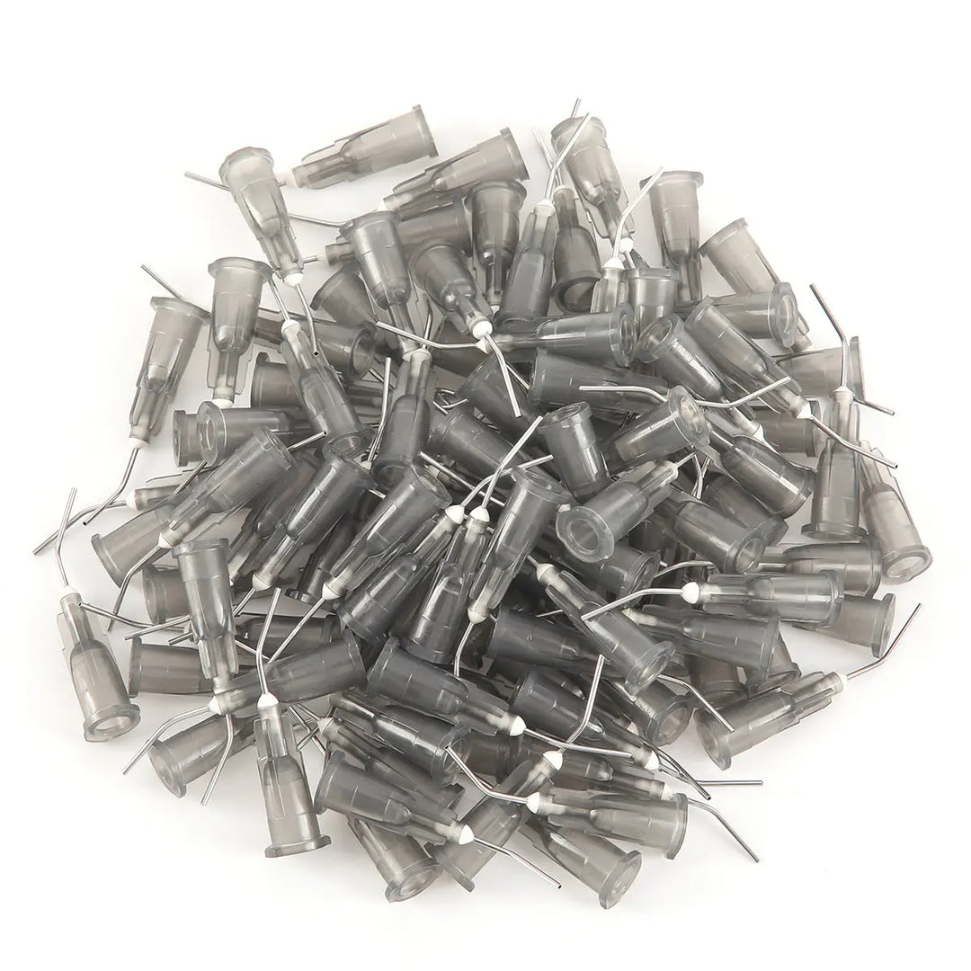 Assorted dental pre-bent needle tips from "5 Bags Dental Pre Bent Needle Tips 9 Models 100pcs/Bag" product, showing various sizes and gauges of clear plastic disposable tips for luer lock syringes, suitable for professional dental use