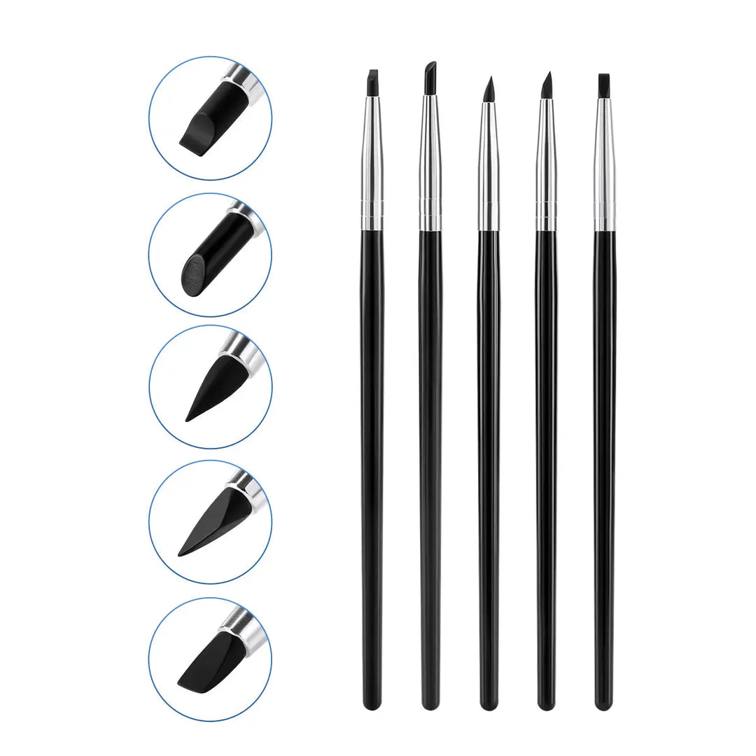 Dental Porcelain Brush Pen set featuring 5 silicone brushes with different nib shapes for composite cement shaping, smoothing, and removing. Black handles with silver metal ferrules. Close-up of each nib shape shown in circular insets on the left side.