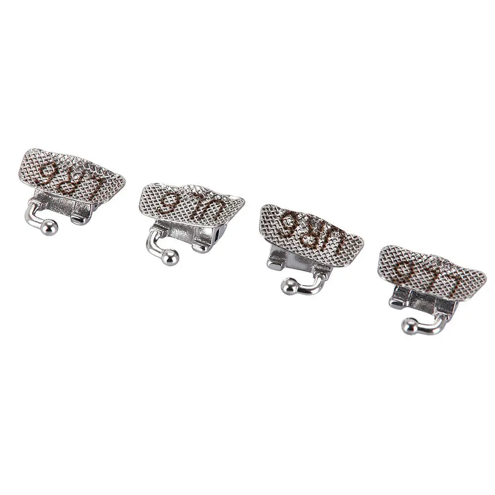 Four silver-colored Buccal Tube 1st Molar Bondable Convertible U1L1 MBT 0.022 dental orthodontic devices arranged in a row on a white background. Each tube has a textured surface and small protruding hooks, showcasing the product's design for orthodontic treatment.