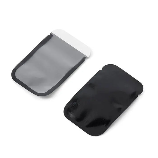 Dental X Ray Phosphor Plate Barrier Envelopes Size #0 #1 #2 100pcs/Box: Two barrier envelopes for dental X-ray phosphor plates, one gray and one black, showcasing the Y-notch design for easy opening and protection against contamination and light exposure.