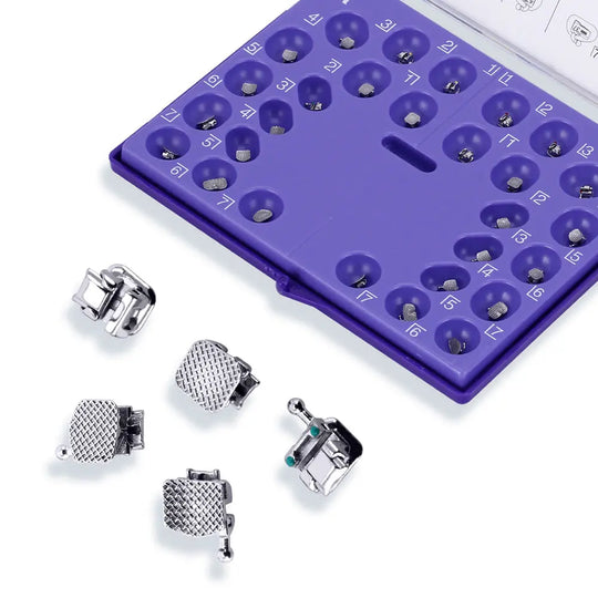 Dental Self-Ligating Brackets Passive Roth .022 Hooks on 345 With Buccal Tube 28pcs/Box: Purple orthodontic bracket organizer with numbered slots, displaying various metal dental brackets and buccal tubes for orthodontic treatment