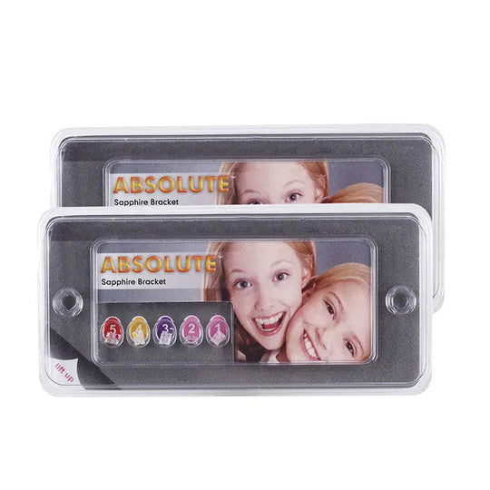 Two transparent cases containing Dental Ceramic Bracket Monocrystalline Sapphire Roth 0.022 Hooks on 3 20pcs/Box. Each case displays "ABSOLUTE Sapphire Bracket" branding and colorful bracket samples, showcasing the product's design and color-coding system for easy identification.