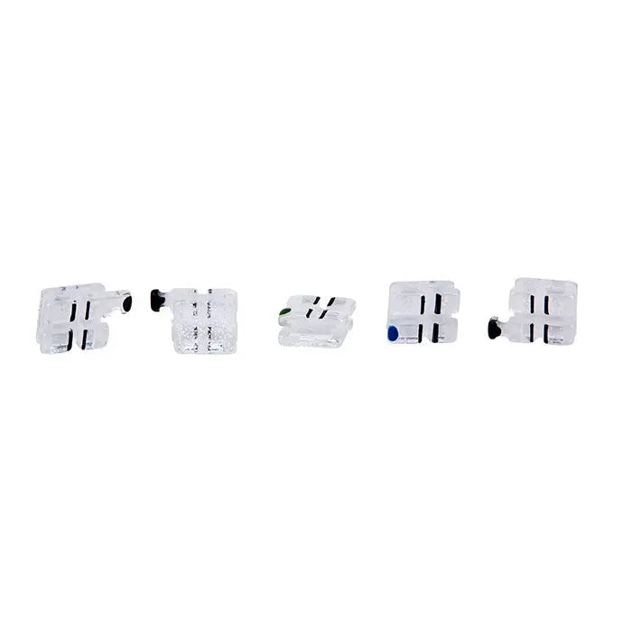 Dental Ceramic Bracket Monocrystalline Sapphire MBT .022 Hooks on 345 20pcs/Box: Five white ceramic dental brackets with black markings and colored dots, arranged in a row against a white background, showcasing their clear and miniature design for orthodontic use.