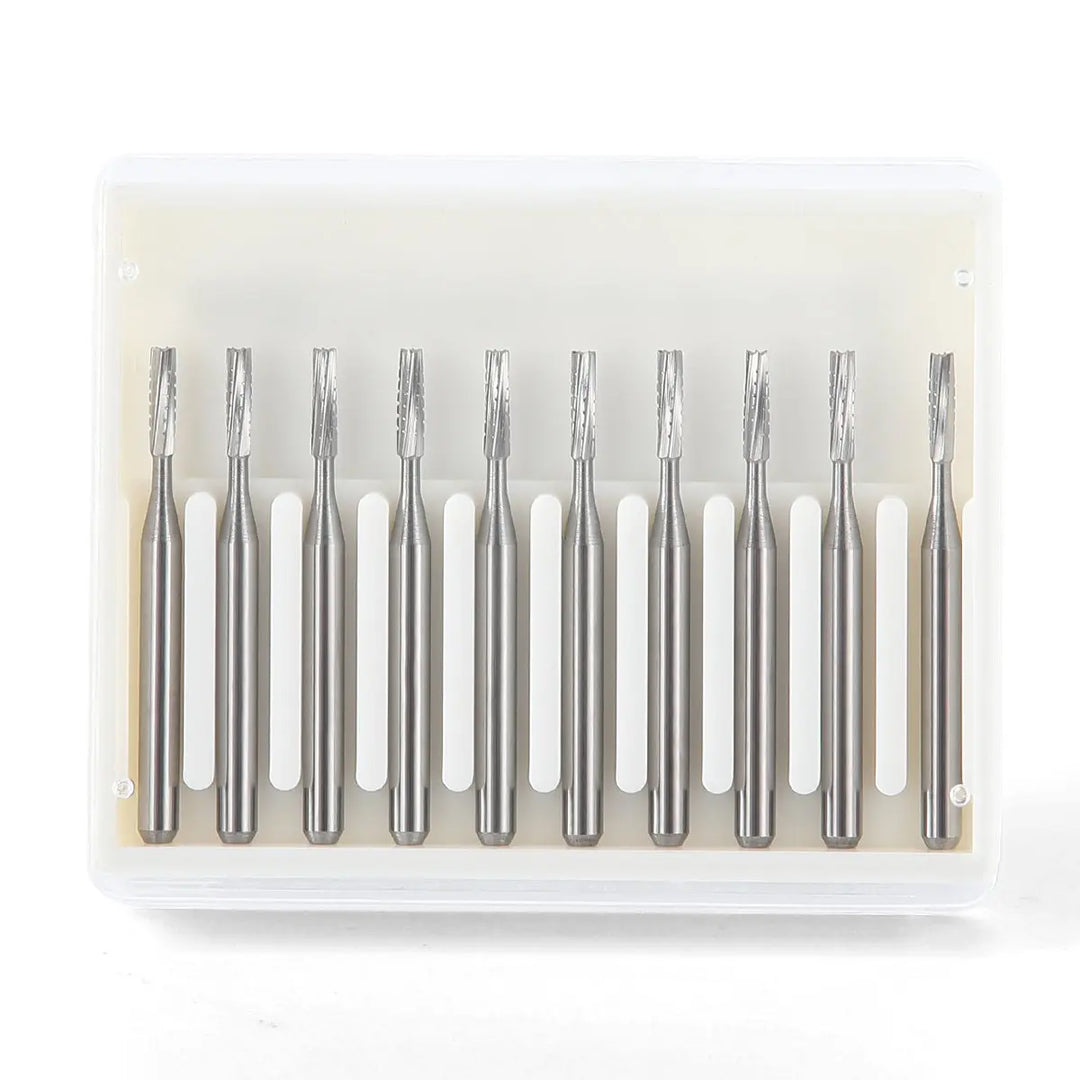 Dental Carbide Bur FG #557 Straight Fissure Crosscut 10/Box: High-speed tungsten steel dental burs in clear plastic case. Ten silver metallic cylindrical burs with straight fissure crosscut design, arranged neatly in two rows. Precision tools for dental procedures.