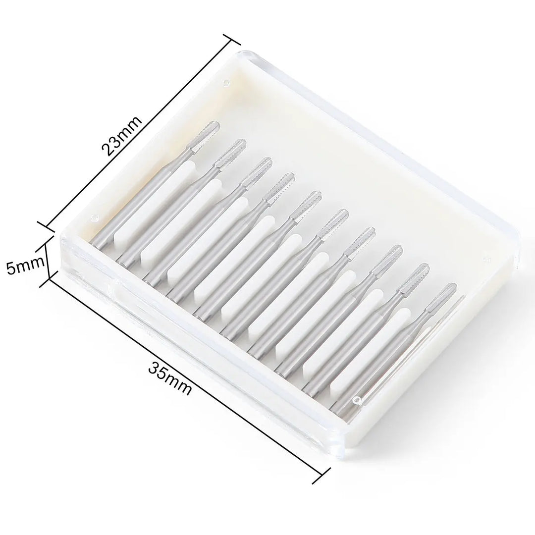 Dental FG #1958 Metal Cutter Carbide Bur 10pcs/Box in white plastic case. Ten silver dental burs arranged neatly in a row. Case dimensions shown: 23mm x 39mm x 5mm. High-speed handpiece tools for cutting metal in dental procedures.