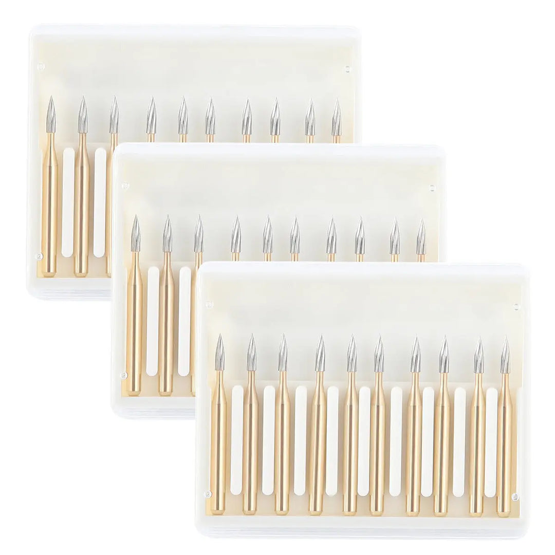 Dental Carbide Burs FG 7902 Needle Shaped Trimming & Finishing 10pcs/Box: Set of titanium-coated tungsten carbide dental burs with needle-shaped tips, displayed in three rows. Each bur features a gold-colored shaft and silver cutting head, designed for precision trimming and finishing in dental procedures.