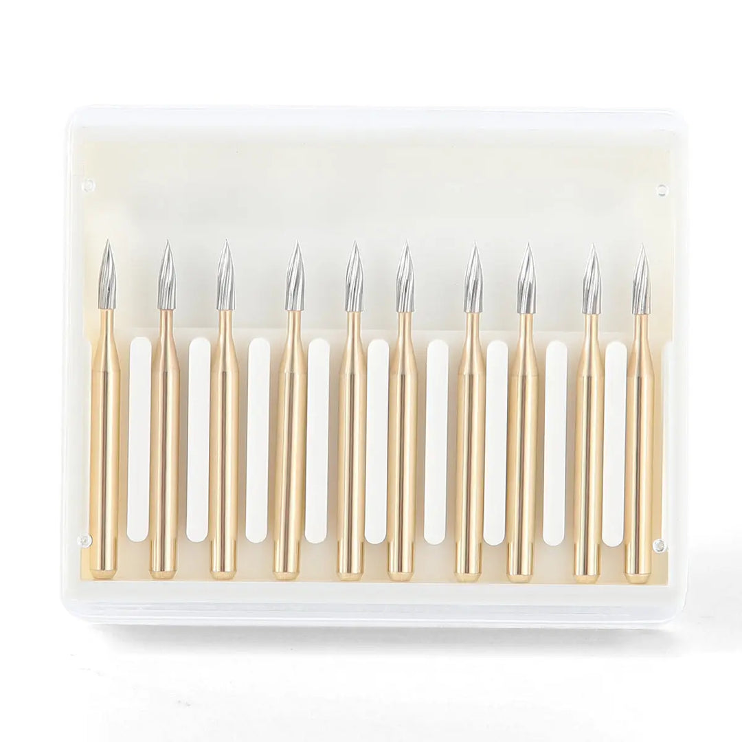 Dental Carbide Burs FG 7902 Needle Shaped Trimming & Finishing 10pcs/Box: Set of ten gold-colored dental burs with long, slender needle-shaped tips arranged in a row on a white plastic holder, designed for precise dental trimming and finishing procedures