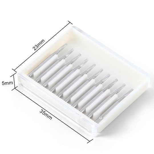 Dental Carbide Bur FG #701 Flat End Taper Fissure Crosscut 10pcs/Box in white plastic case. Box contains 10 silver metal burs with tapered ends, neatly arranged in rows. Case dimensions shown as 35mm x 23mm x 5mm.