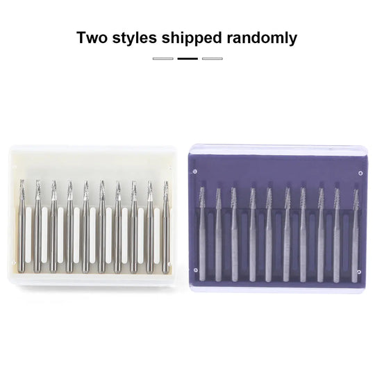 Dental Carbide Bur FG #701 Flat End Taper Fissure Crosscut 10pcs/Box displayed in two packaging styles: a clear plastic case and a purple case, each containing 10 silver dental burs arranged in a row. Text above indicates random shipping of styles.