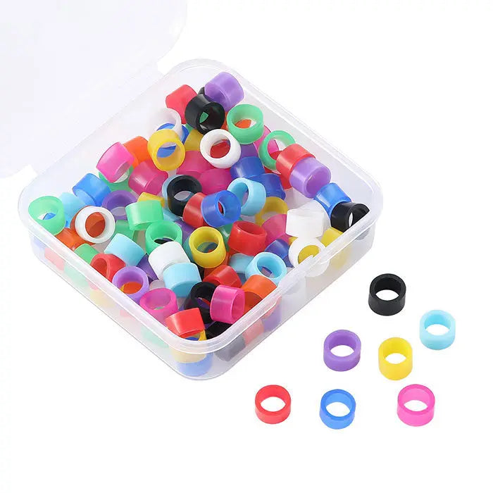 Dental Color Code Rings Universal Silicone Autoclavable 10 Colors 100pcs/Box: Clear plastic container filled with colorful silicone rings in various sizes and vibrant colors, including red, blue, green, yellow, purple, and pink, used for dental instrument identification and organization.