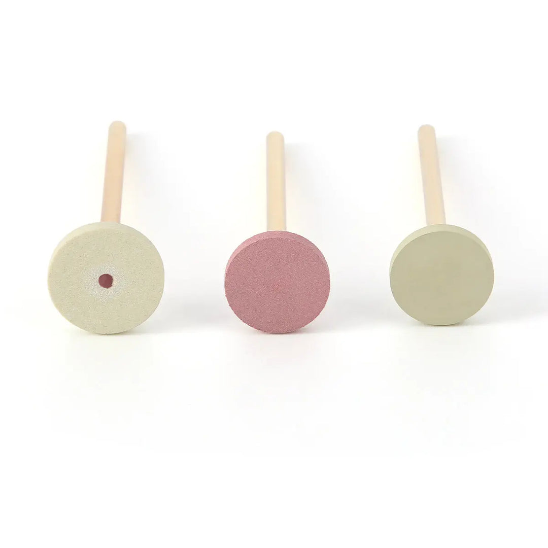 Dental Zirconia Grinding and Polishing Kit featuring three polishing heads: two light green circular discs and one pink circular disc, mounted on wooden handles. Designed for efficient ceramic and zirconia restoration polishing.