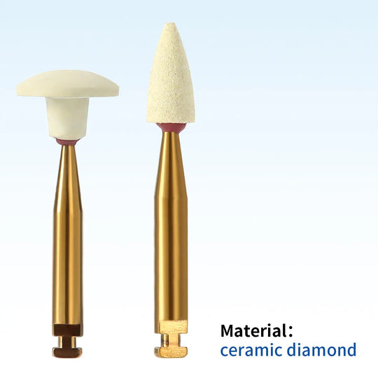 Dental Zirconia Grinding and Polishing Kit featuring two ceramic diamond polishers with gold-colored shafts and white tips, one conical and one flat-topped, for contra angle handpiece. Material: ceramic diamond, suitable for zirconia restoration.