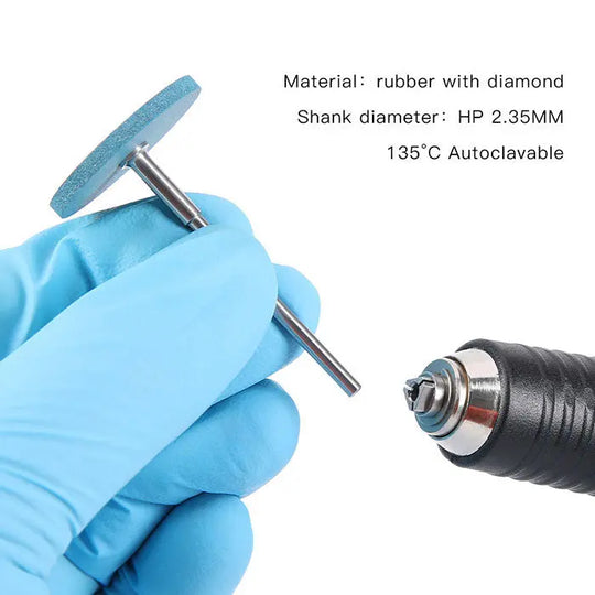 Dental Rubber Diamond Polisher Wheel held by gloved hand, showcasing blue coarse grit wheel and metal shank. Handpiece visible in corner. Product details listed: rubber with diamond material, 2.35MM shank diameter, 135°C autoclavable.