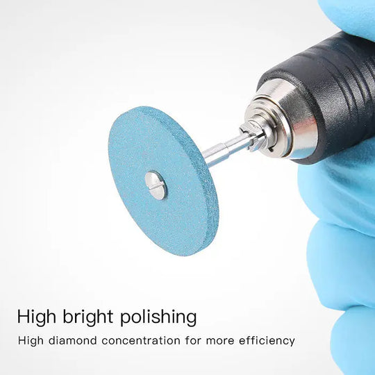 Dental Rubber Diamond Polisher Wheel in blue attached to dental handpiece, demonstrating high diamond concentration for efficient polishing of dental materials like zirconia and porcelain