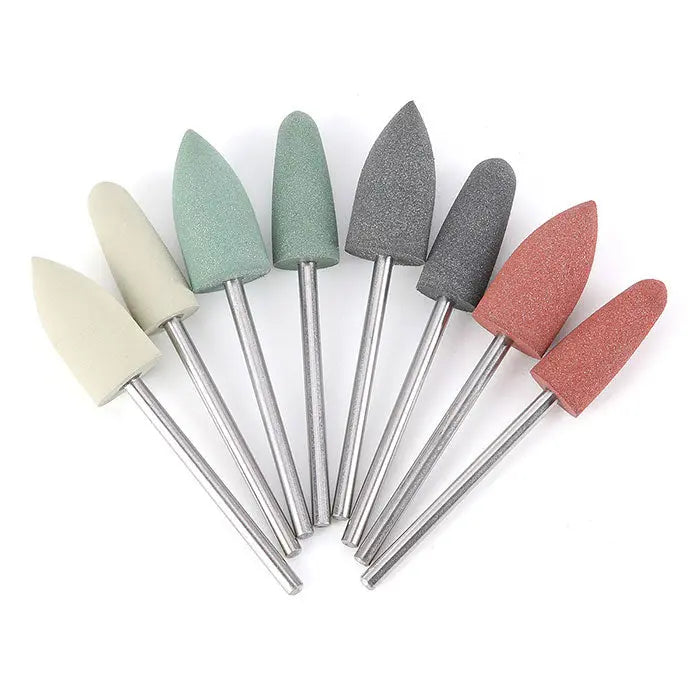 Dental Lab Polishing Kit for Composite Ceramic HP Shank 51pcs/Box featuring various shaped polishing burs in different colors including white, green, gray, and pink, arranged in a fan-like pattern with metal shanks visible