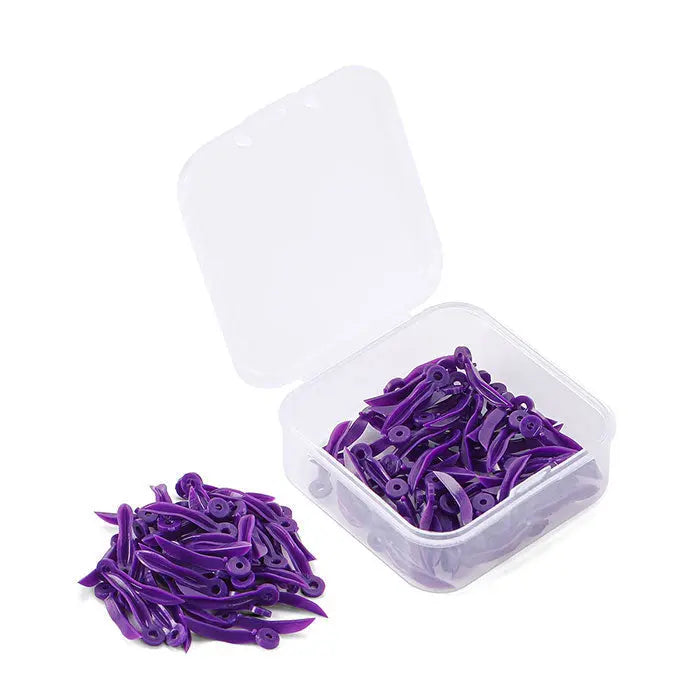 Dental Disposable Wedges With Hole Plastic Tooth Gap Wedge 4 Sizes 100pcs/Box: Purple dental wedges in transparent storage box, showcasing large size wedges with circular holes for easy handling, designed for interdental spaces during dental procedures.