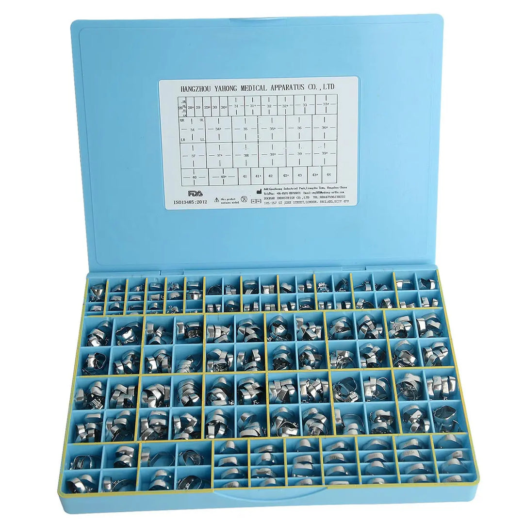 Dental Buccal Tubes Band Roth .022 1st Molar Single Welded & Conv 85sets/Box displayed in a light blue plastic case. The case contains multiple compartments filled with small metal orthodontic components. A sizing chart is visible on the inside lid of the case.