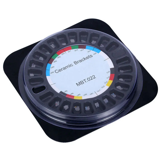 Dental Orthodontic Ceramic Brackets Full Size Hooks 345 20pcs/Box in circular container with colorful labels indicating MBT.022 slot size, displayed on black surface. Clear plastic lid shows organized arrangement of brackets inside.