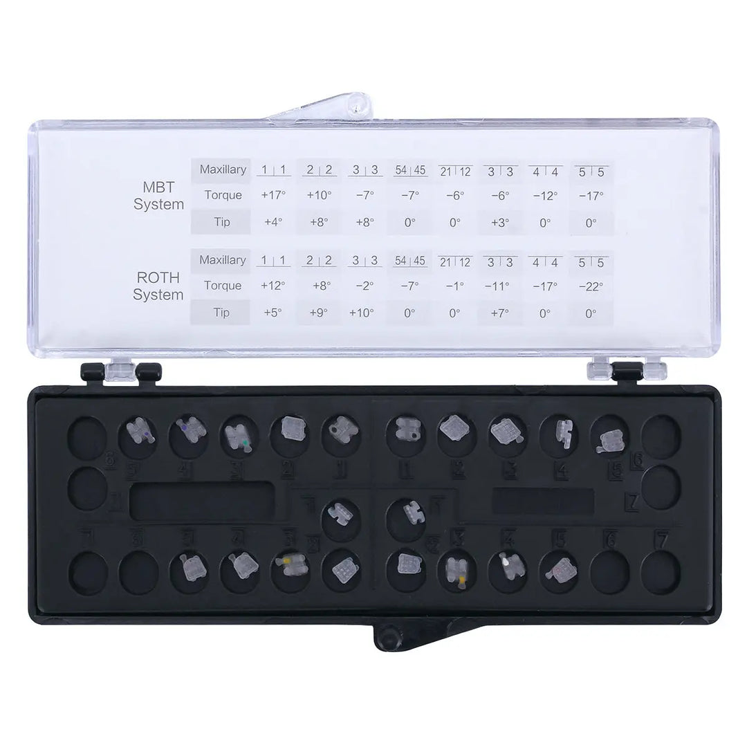 Ceramic Brackets Roth .018 Mesh Base 345/Hooks 20/Box displayed in orthodontic storage case with MBT and ROTH system measurements. Black tray holds multiple ceramic brackets in organized slots for dental use.