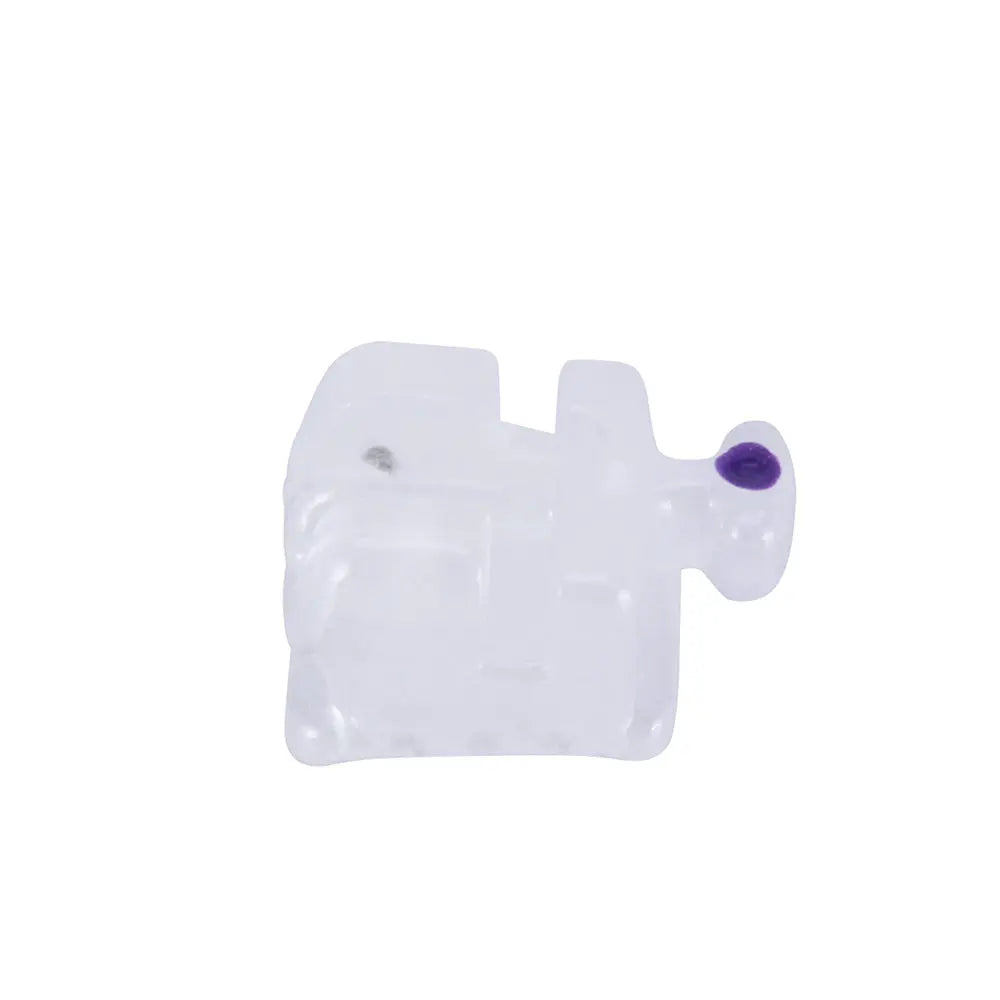 Dental Self-ligating Ceramic Bracket Roth 0.022 Hooks on 345 20pcs/Box: Close-up of a single translucent white ceramic orthodontic bracket with a small purple dot, showcasing its low-profile design and smooth edges for patient comfort