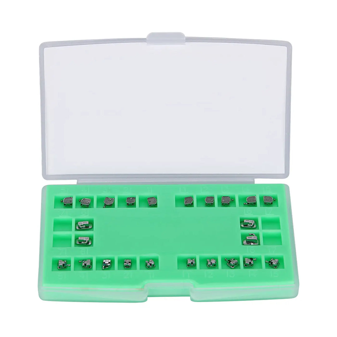 Dental Metal Self Ligating Mini Bracket set in green plastic case with individual slots for brackets and buccal tubes. Clear lid shows organized orthodontic components for Roth .022 system with hooks on 345.