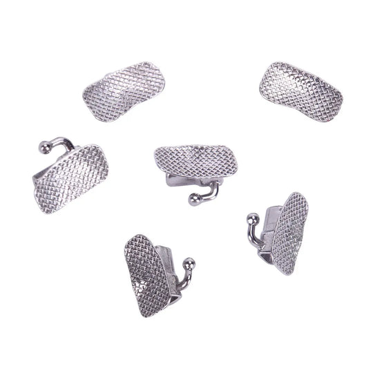 Six silver-colored Buccal Tube 1st Molar Bondable Split Non-Convertible Roth 0.022 dental orthodontic attachments arranged in a circular pattern on a white background. Each tube features a textured mesh surface for bonding and a small hook for orthodontic elastics.