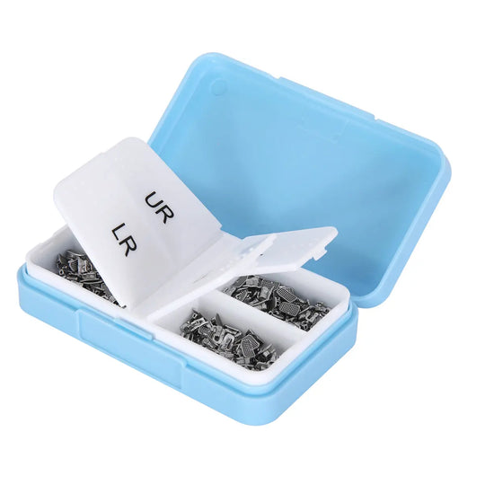 Buccal Tube 1st Molar Monoblock Non-Convertible MBT 0.018 50Sets/Bx in a blue plastic container with white dividers labeled UR and LR, containing small metal orthodontic components for dental use