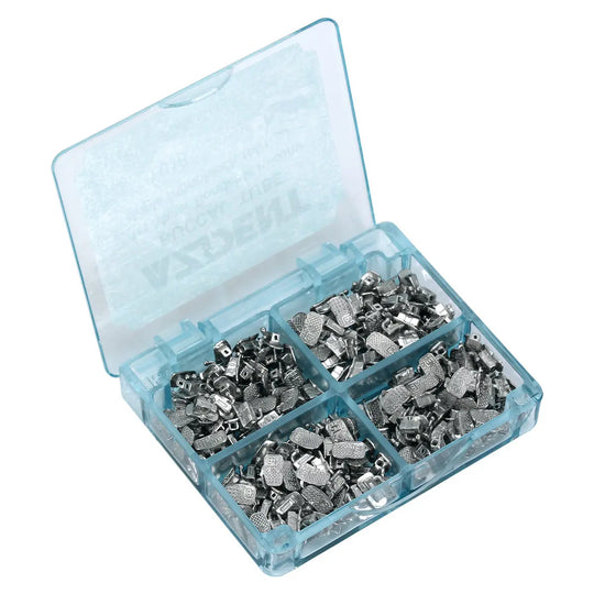 Buccal Tube 1st Molar Bondable Monoblock Non-convertible Roth 0.018 50Sets/Bx displayed in a transparent blue plastic case. The case contains multiple small silver-colored metal orthodontic components sorted into four compartments, showcasing the product's organization and quantity.