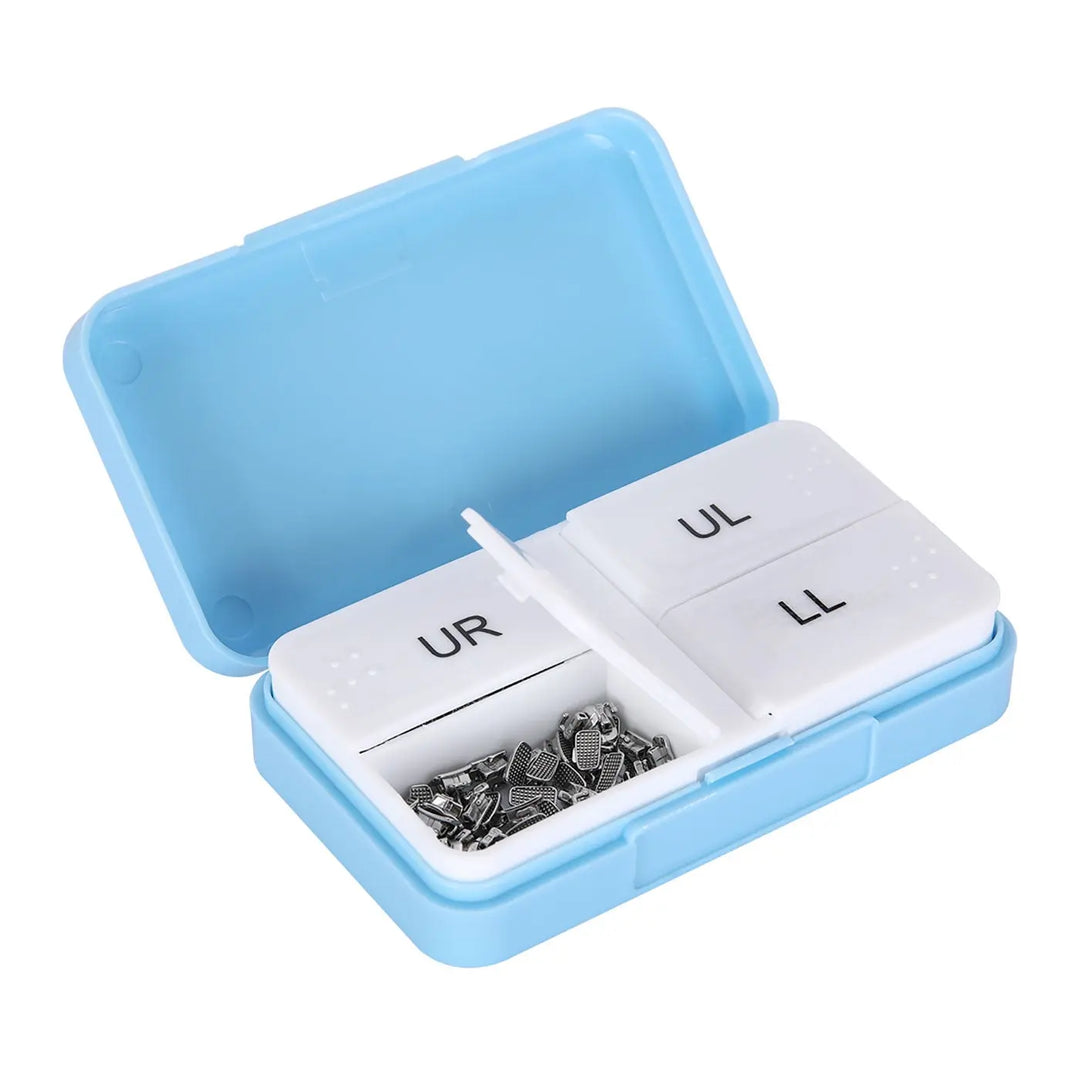 Buccal Tube 1st Molar Bondable Monoblock Non-Convertible MBT 0.022 50Sets/Bx in blue plastic container with compartments labeled UR, UL, LL containing small metal orthodontic components for dental use