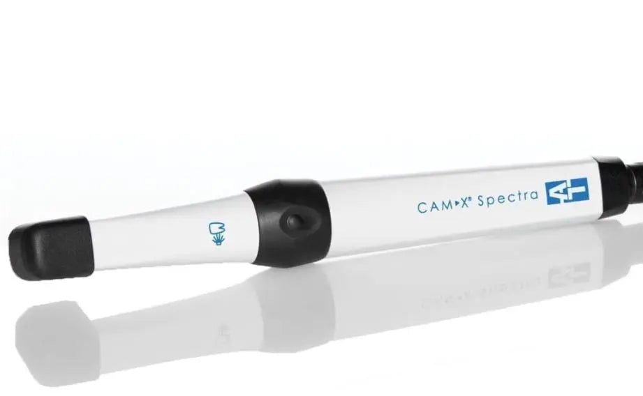 CamX Spectra Caries Detection Aid handheld device with white cylindrical body, black grip and tip, and blue logo displayed on side, designed for early tooth decay detection using fluorescence technology in dental practices