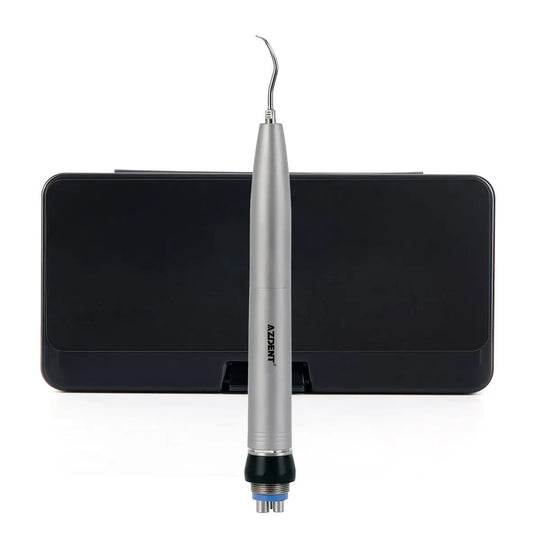 Dental Air Scaler Handpiece Sonic S with sleek silver body and curved tip, positioned on a black stand. Professional dental tool for precise cleaning and scaling, featuring high-frequency oscillation and integrated spray system.