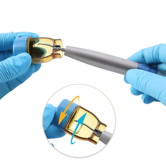 Dental Air Scaler Handpiece with Fiber Optic 3 Power Levels 3 Tips being assembled, showing gloved hands attaching the golden head to the silver body. Inset image demonstrates the rotation mechanism of the scaler head.