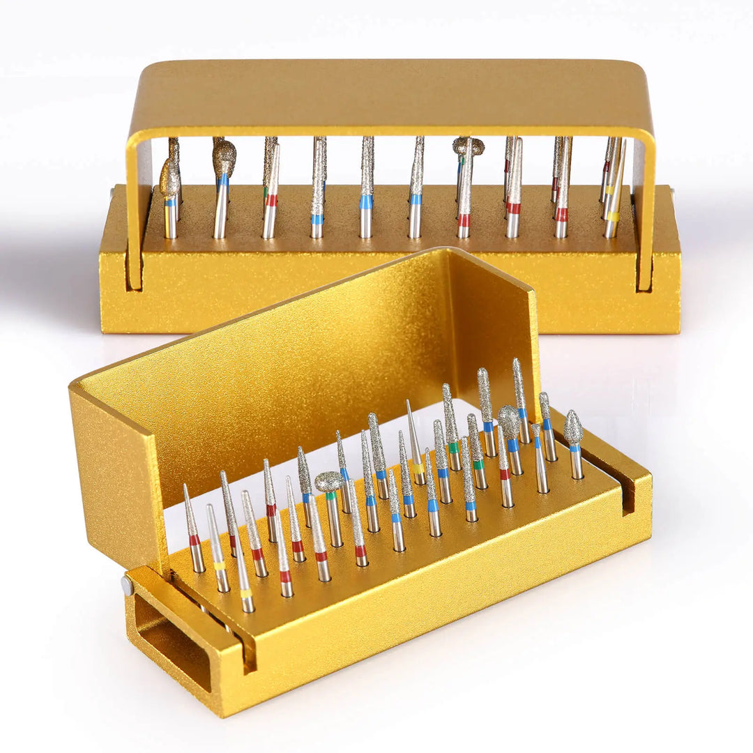 Golden dental burs drill disinfection block with 30 holes for high-speed handpieces, showcasing two open aluminum containers filled with various dental burs organized in rows for sterilization and storage.