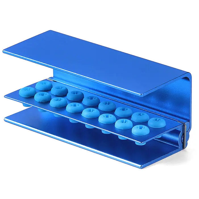 Dental Burs Holder Block 16 Holes with Silicon Cover FG RA Autoclavable: Blue aluminum dental bur block with 16 circular holes for high and low speed burs, featuring a protective silicon cover. Autoclavable and designed for hygienic, ergonomic dental procedures.