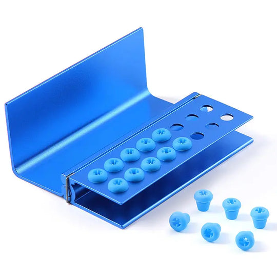 Dental Burs Holder Block 16 Holes with Silicon Cover FG RA Autoclavable: Blue aluminum dental bur block with 16 holes and removable blue silicon covers, designed for organizing and sterilizing high and low speed dental burs, featuring an autoclavable metal construction for hygienic dental procedures