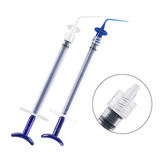 Dental Disposable Endo Irrigation Syringe 50 Pcs And Tip 50 Pcs: Two plastic syringes with blue tips and a close-up of the tip attachment, demonstrating the product's design for precise dental irrigation procedures