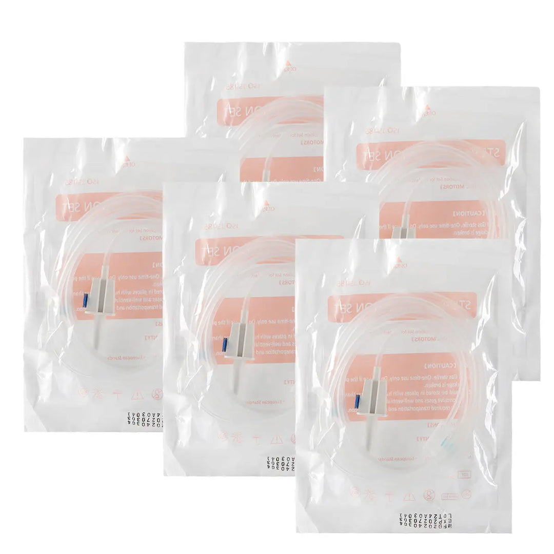 Dental Irrigation Disposable Tubes in sealed plastic bags, packaged for single-use application in implant surgery cooling. Clear bags with pink labels containing product information for COXO C-SAILOR and A-CUBE compatible oral irrigation kits and tubing sets.