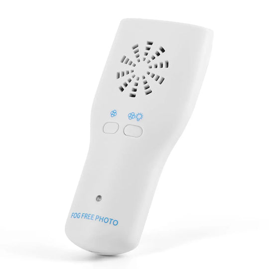 Dental LED Automatic Anti-fog Mirror for Oral Photography: White handheld device with circular ventilation pattern, blue snowflake icons, and two control buttons. Features "FOG FREE PHOTO" text, designed for clear dental imaging.