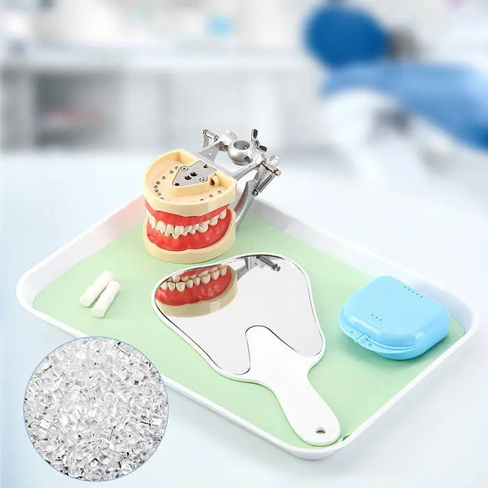 Dental Mouth Mirror Teeth Shaped Mirror Handheld Unbreakable Plastic displayed with dental models, tooth-shaped mirror, and dental tools on a tray, showcasing practical dentistry equipment and tooth-themed design