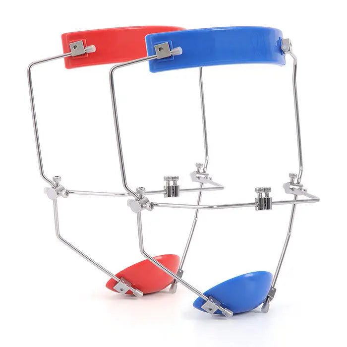 Dental Orthodontic Forward Pull Headgear Face Mask with Double Lever Adjustable. Stainless steel frame with red and blue plastic components. Adjustable forehead and chin rests. Used for orthodontic treatment of maxillary hypoplasia and mandibular prognathism.