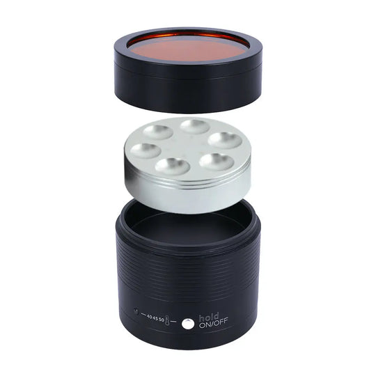 Dental Resin Composite Softener Heater Material Warmer 40℃-50℃ with black cylindrical base, silver heating plate with six circular indentations, and orange-tinted transparent lid for dental composite resin heating and softening.