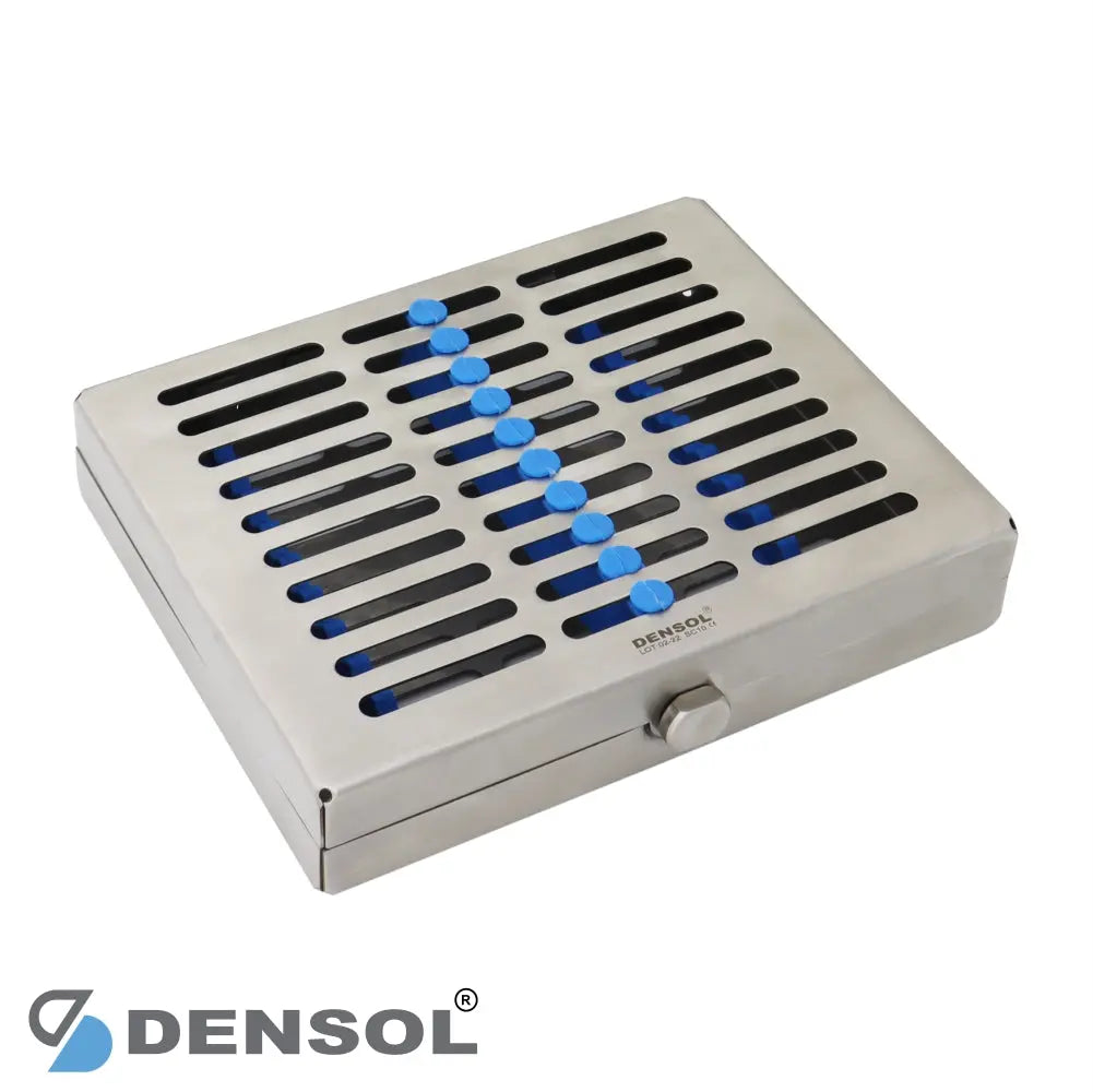 Dental Sterilizing Cassettes Medium 10 Pcs Tray: Stainless steel cassette with perforated lid and blue silicone instrument holders, designed for sterilizing dental tools. Densol brand logo visible.