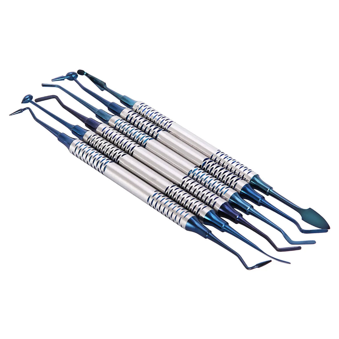 Dental Tools Composite Resin Filling Spatula Titanium Plated Head Filler Blue: Set of six professional dental instruments with blue handles, silver metal shafts, and specialized tips for precise composite resin application and shaping in dental procedures.