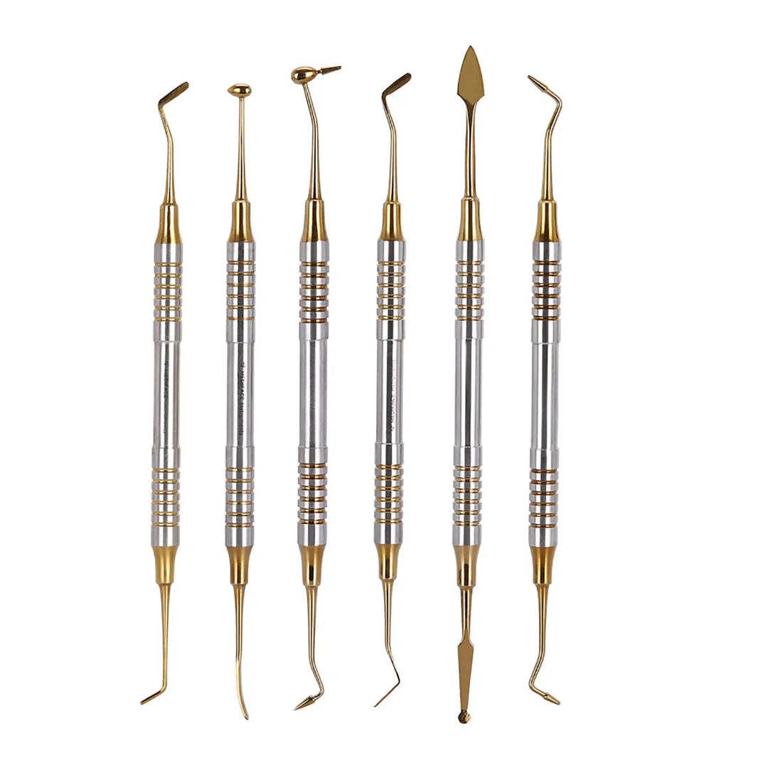 Set of six Dental Tools Composite Resin Filling Spatulas with Titanium Plated Gold Heads, featuring various curved and straight tips for precise dental work, arranged in a row on white background