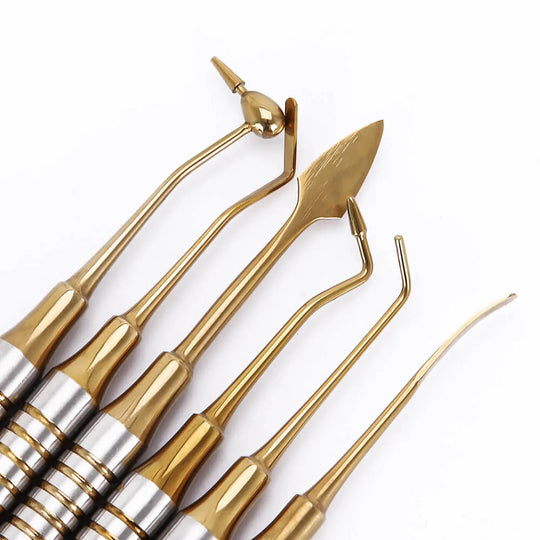 Dental Tools Composite Resin Filling Spatula Titanium Plated Head Filler Gold: Set of 6 gold-colored dental instruments with stainless steel handles and titanium-plated tips, including various spatulas and burnishers for composite resin filling procedures, displayed on white background.